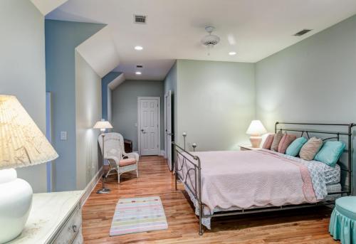 Tasteful attic bedroom with hard wood floors